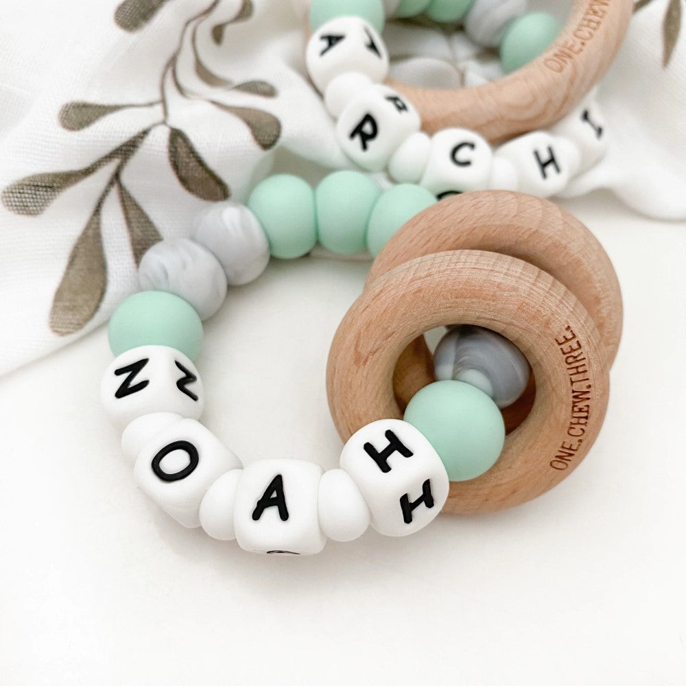 Personalised Silicone Beads On Wooden Rings Teether Rattle