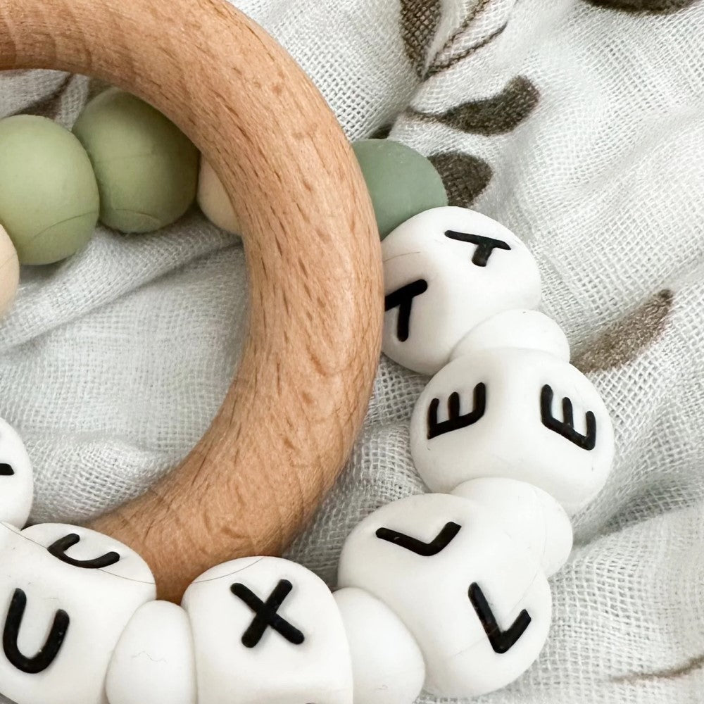 Personalised Silicone Beads On Wooden Rings Teether Rattle